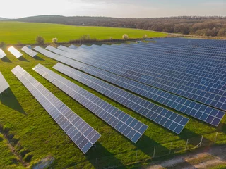 Aerial view industrial Photovoltaic solar units panels environment producing renewable green energy © sefoma