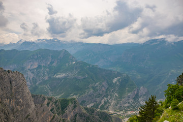 Naklejka premium The tops of the picturesque mountains are covered with white snow.