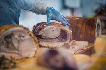 Preparing large roasted pork chops for serving at a plant canteen © AK-Snapshot