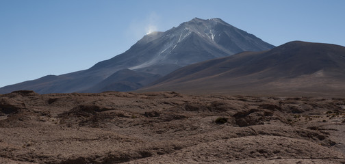 Fototapeta na wymiar Mirador of Volcano Ollague. It's a massive stratovolcano on the border between Bolivia and Chile and its highest summit is 5,868 m