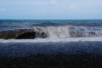 Stormy sea waves breaking near the coast