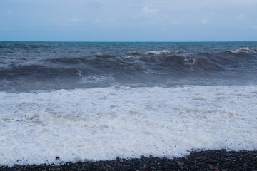 Stormy sea waves breaking near the coast