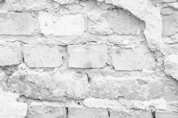 Texture of a white ruined brick wall
