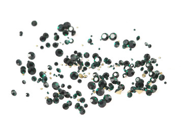 Many scattered rhinestones. On a white background