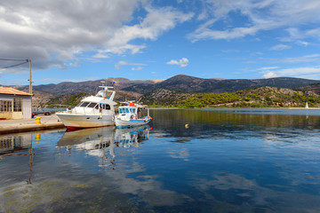 Fishing boats anchoring in beautiful bay in Argostoli town on Kefalonia island. Greece