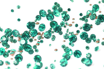 Many scattered rhinestones. On a white background