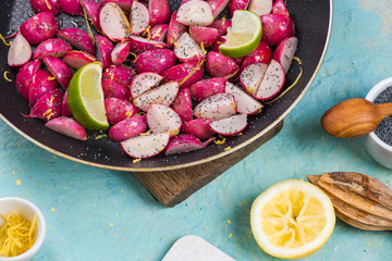 cooked spring radish with poopy seeds and lemon