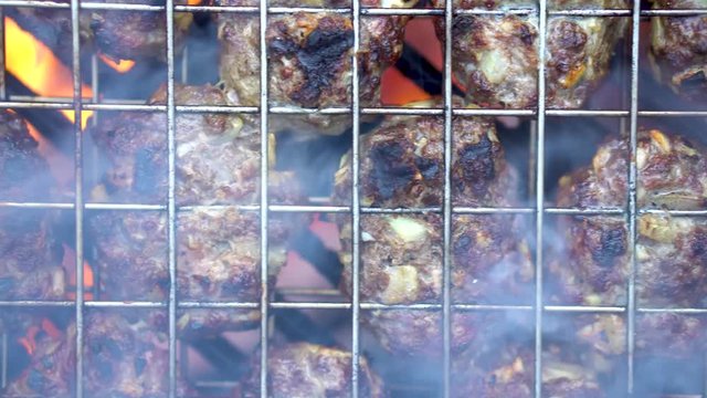 Closeup overhead shot of cooking kofta with camera moving around.