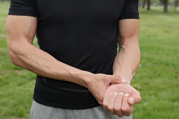 Sportsman checking his pulse close up