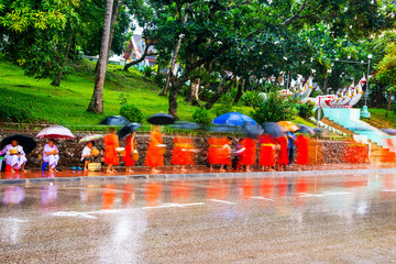 Alms giving in the morning in Luang Praband, Laos. Motion blurred people