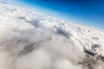 above the clouds, travel by plane