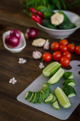 Fresh vegetables on a dark wooden background