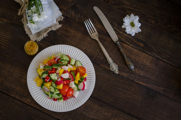 Vegetables salad on a white plate