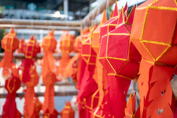 Naklejka premium Thai Paper Lanterns or lamps at a party or festival hanging on wooden structure.