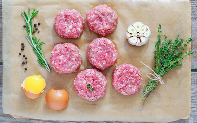 chopped steaks with rosemary, garlic, egg and thyme