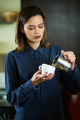 Young beautiful cafe manager working