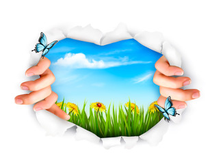 Fototapeta premium Nature background with hands ripping a paper. Vector