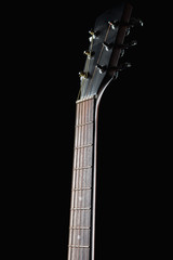 guitar neck on a black background