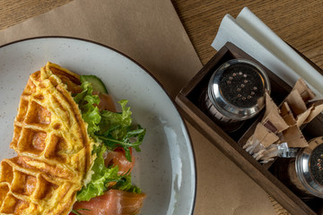 Nutritious and healthy breakfast - Omelet with vegetables, with salad leaves and red fish - salmon. The concept of proper nutrition