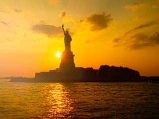 The Statue of Liberty in New York City at sunset