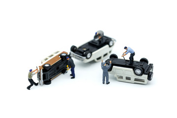 Miniature people :  Technician auto mechanic with a wrench working in garage,Car repairing ,Repair service