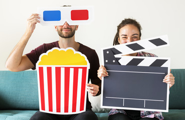 Couple watching movie at home together