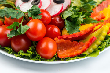 Salad with fresh summer vegetables, white background