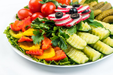 Salad with fresh summer vegetables, white background