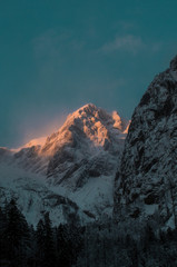 winter alpine mountain landscape during sunset, kamnik alps, slovenia.