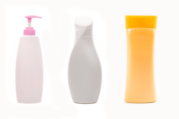 Set of shampoo bottles isolated on white background.