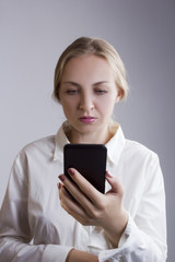 Fototapeta premium Young woman with mobile phone