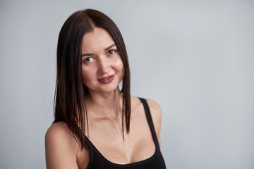Naklejka premium beautiful woman in black dress, close-up portrait