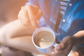 Coffee cup in woman hand.