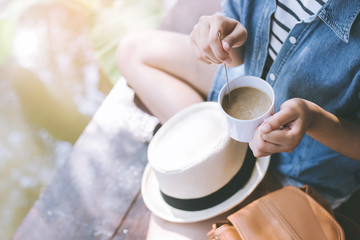 Coffee cup in woman hand.