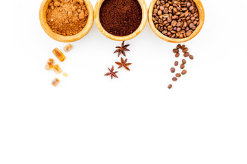 Ingredients for bakery and desserts. Cinnamon, cocoa, coffee, sugar, spices on white background top view space for text