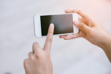 Hand woman using smartphone.