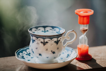 Elegant tea cup and hourglass stand shelf