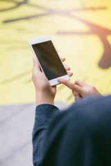 Woman use mobile phone in the city