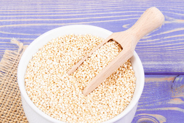 Quinoa seeds containing natural minerals and vitamins, concept of healthy nutrition
