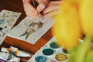00:18 | 00:19 1×  female artist painter painting a picture of a easter bunny