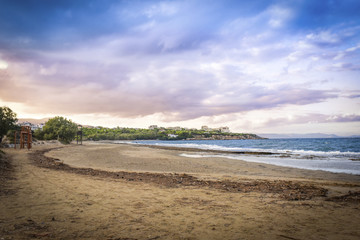  Sunset with dramatic sky over the beach at Rafina, Greece