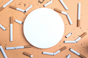 Blank round frame with cigarettes. Place for text.