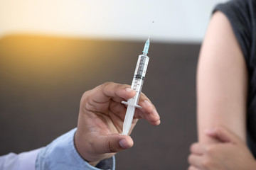 Medicine and health care concept Doctor giving patient vaccine insulin or vaccination