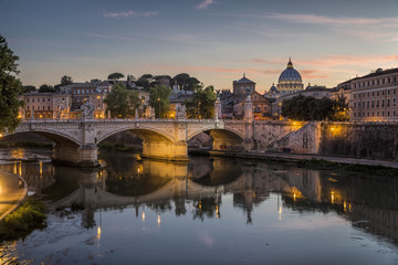 St Peter's Cathedral and the river Tiber in Rome at dusk