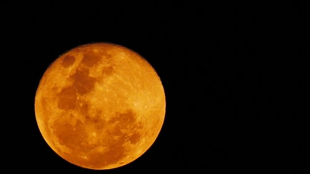 Rising Blood Moon Or Red Moon On Dark Sky