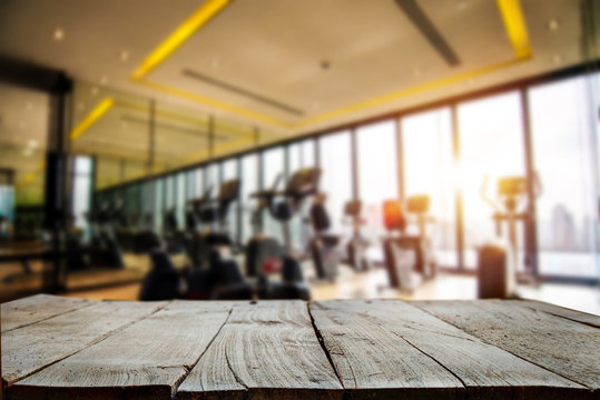fitness gym and wooden table space in morning light
