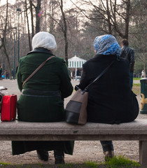 Two women with veil on  head