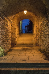 Arch entrance with stone walls to the old city of  Ioannina at night, Greece