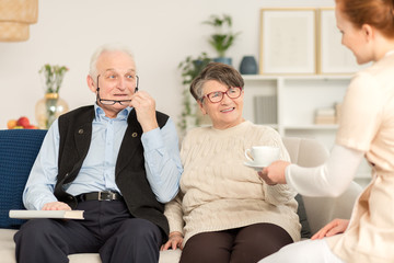 Elderly couple and nurse