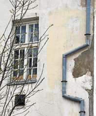 Eaves next to a window on an old house